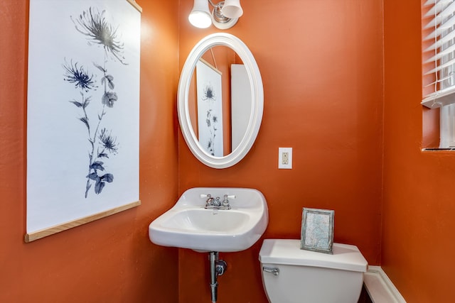 bathroom with toilet and sink