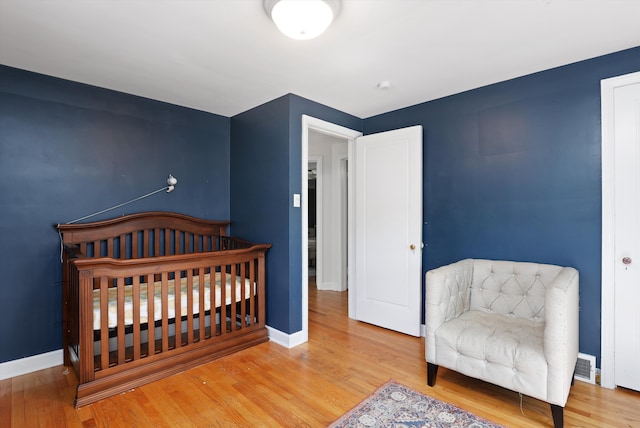 bedroom featuring hardwood / wood-style flooring