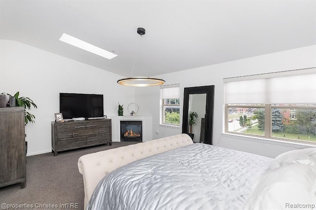 bedroom featuring dark colored carpet and lofted ceiling