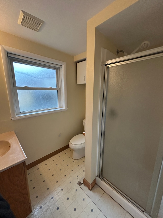 bathroom with toilet, a stall shower, visible vents, and tile patterned floors