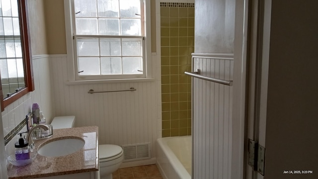 bathroom with vanity, tile patterned floors, and toilet