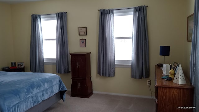 bedroom with light carpet