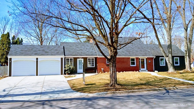 single story home featuring brick siding, driveway, a shingled roof, and a garage