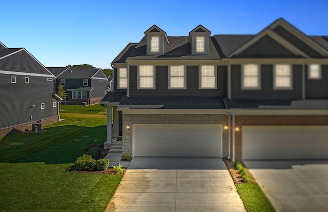 view of front of property with a garage and a front yard