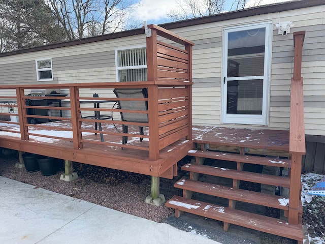 view of snow covered deck