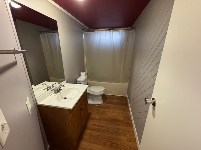 full bathroom with vanity, hardwood / wood-style flooring, shower / bath combination with curtain, and toilet