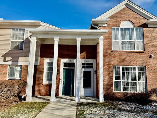 doorway to property with a porch