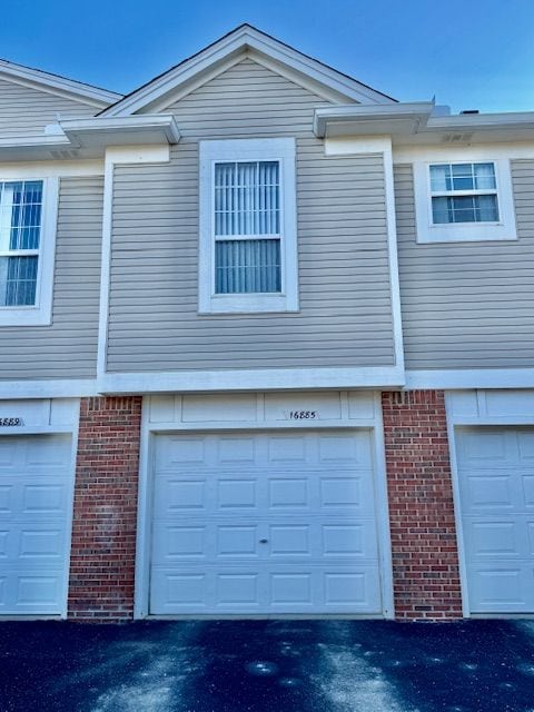 view of side of property with a garage