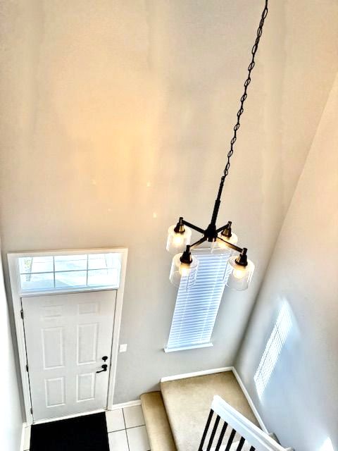 entryway with light tile patterned floors