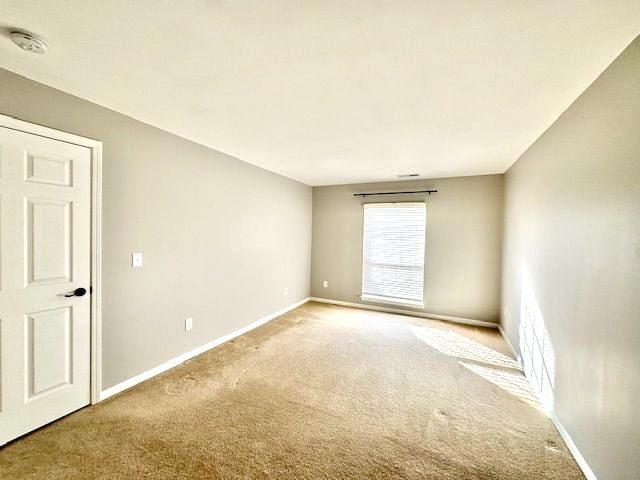 empty room featuring carpet flooring