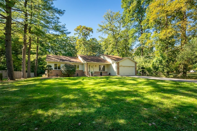 ranch-style home with a garage and a front yard