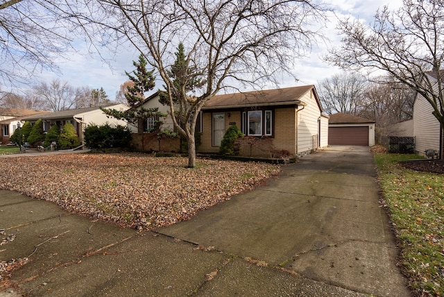 ranch-style home with an outbuilding and a garage