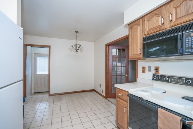 kitchen with hanging light fixtures, light tile patterned flooring, a chandelier, and white appliances