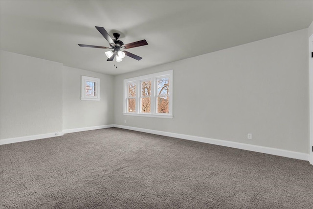 empty room featuring carpet floors and ceiling fan