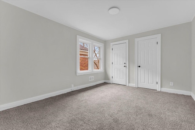 unfurnished bedroom with carpet flooring