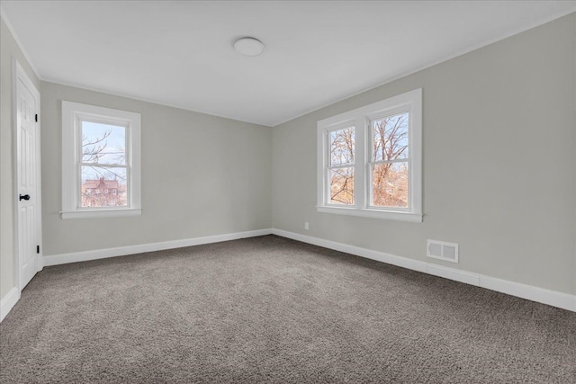 unfurnished room featuring carpet flooring