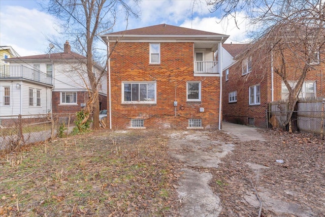 rear view of house featuring a balcony