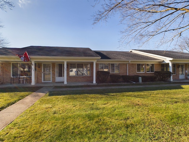 single story home with a porch and a front yard