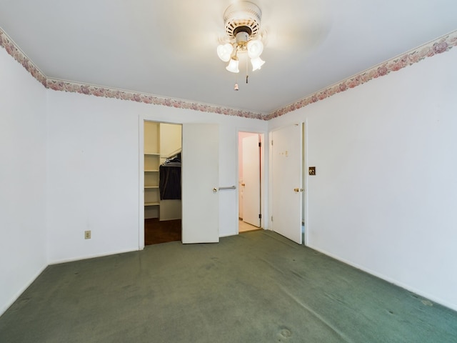 spare room with carpet floors and ceiling fan