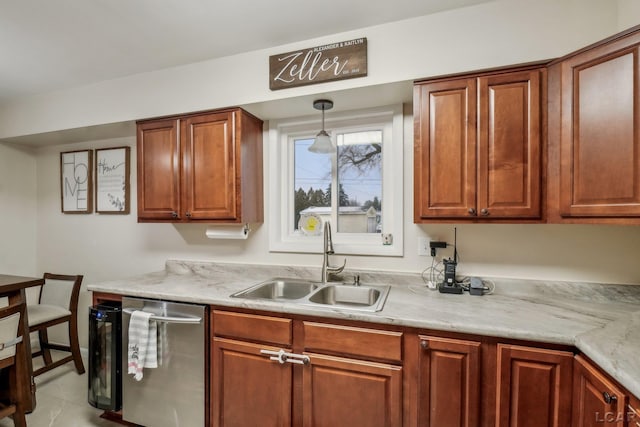 kitchen with light stone counters, sink, light tile patterned floors, dishwasher, and hanging light fixtures