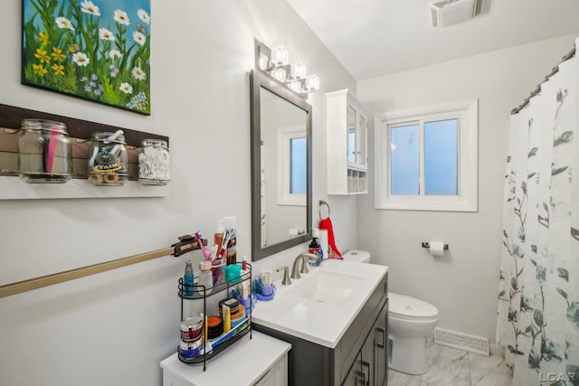 bathroom featuring toilet, visible vents, marble finish floor, and vanity