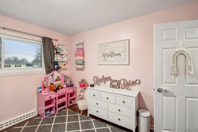 interior space featuring a baseboard heating unit