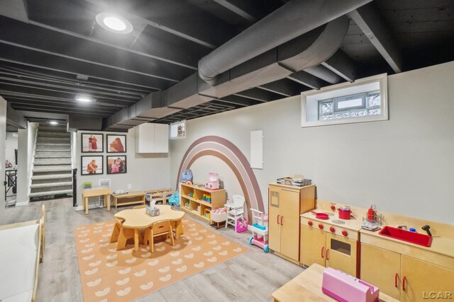 rec room with wood finished floors