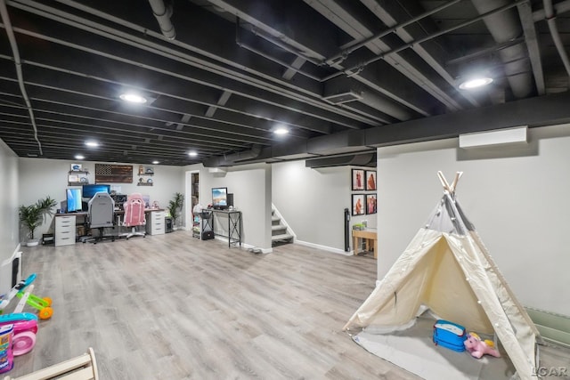 game room with wood finished floors
