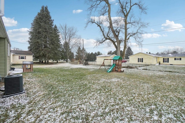 view of yard featuring a playground and central air condition unit