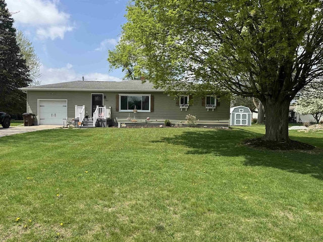 ranch-style home featuring a front yard, a storage shed, an outdoor structure, concrete driveway, and an attached garage