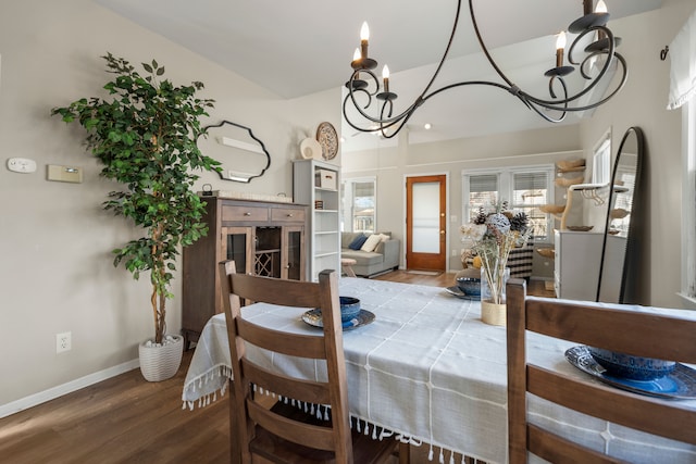 dining area featuring a chandelier and hardwood / wood-style flooring