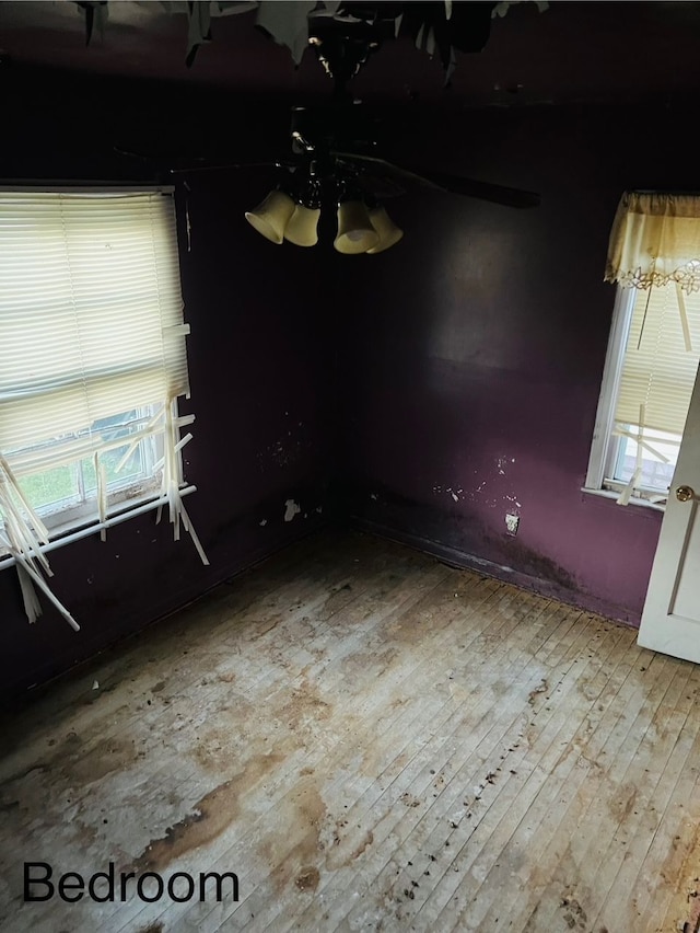 unfurnished dining area featuring hardwood / wood-style flooring