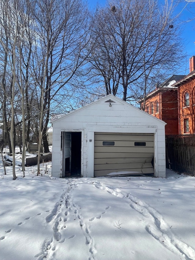 view of snow covered garage