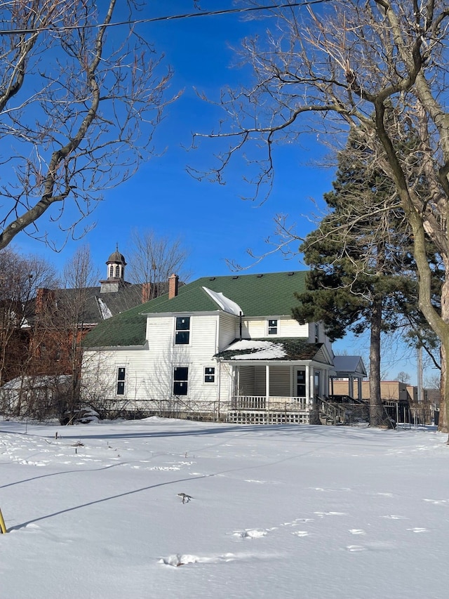 view of front of home featuring a chimney