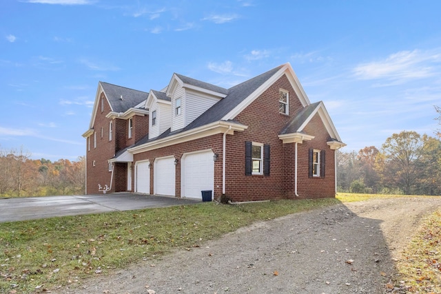 view of side of home with a garage