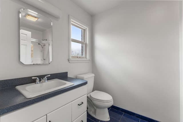 bathroom featuring toilet, tile patterned flooring, a shower, and vanity