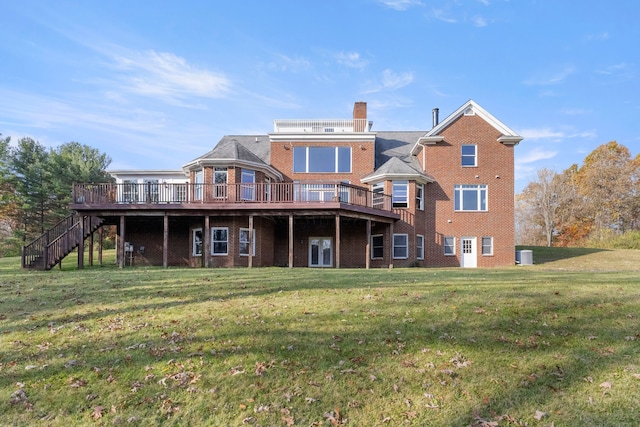 rear view of property with a deck and a yard