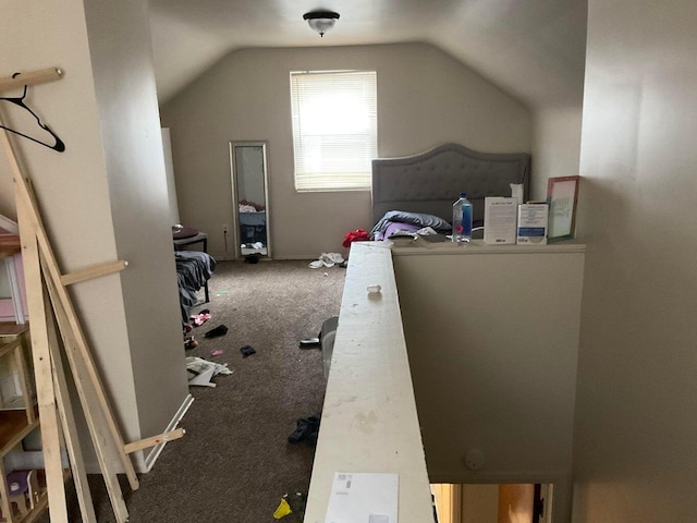 bedroom with carpet flooring and vaulted ceiling