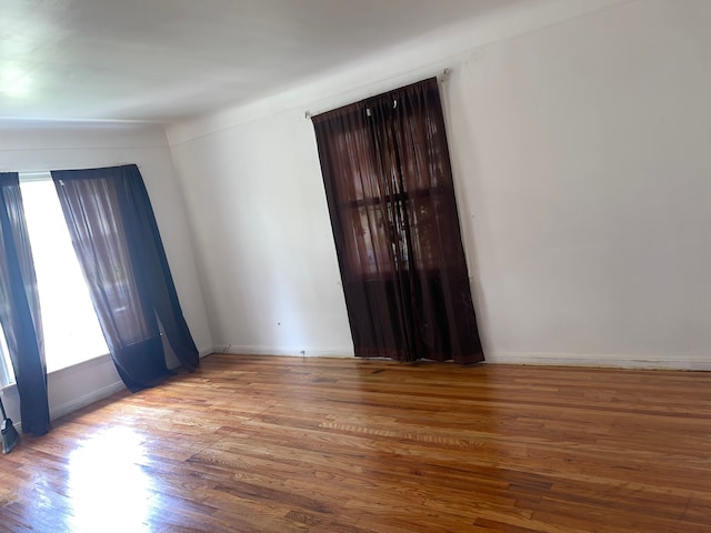 empty room with wood-type flooring