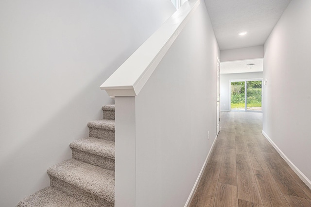 8745 E Sturtevant Ave, Richland, MI 49083 - staircase with wood finished floors and baseboards