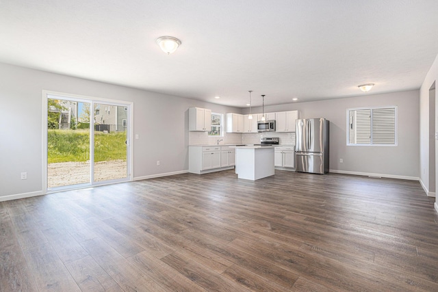 8745 E Sturtevant Ave, Richland, MI 49083 - unfurnished living room featuring dark wood-style floors and recessed lighting
