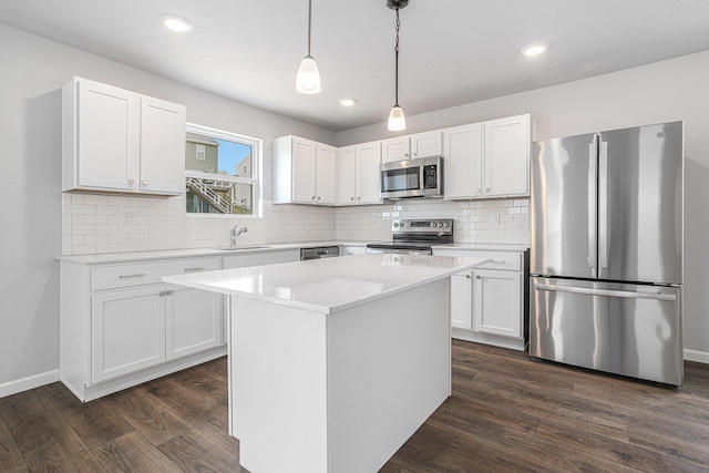 8745 E Sturtevant Ave, Richland, MI 49083 - kitchen featuring stainless steel appliances, dark wood finished floors, white cabinetry, light countertops, and decorative backsplash