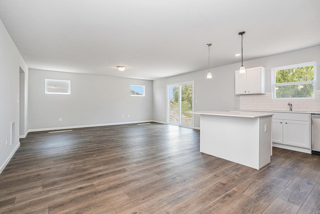 8745 E Sturtevant Ave, Richland, MI 49083 - kitchen with open floor plan, dark wood-style floors, and white cabinetry