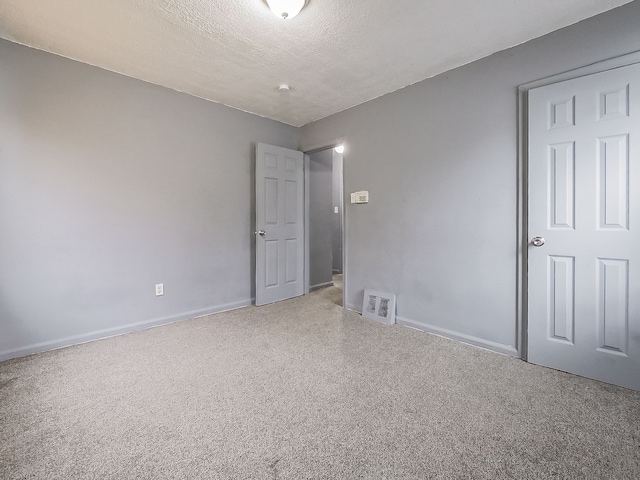 unfurnished bedroom featuring a textured ceiling