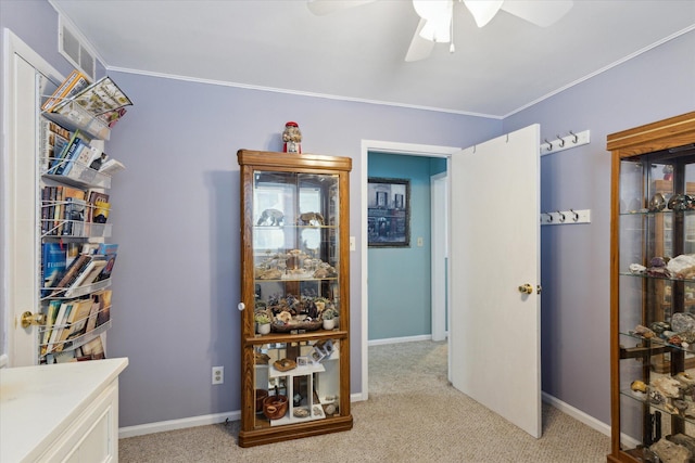 hall with light carpet and ornamental molding