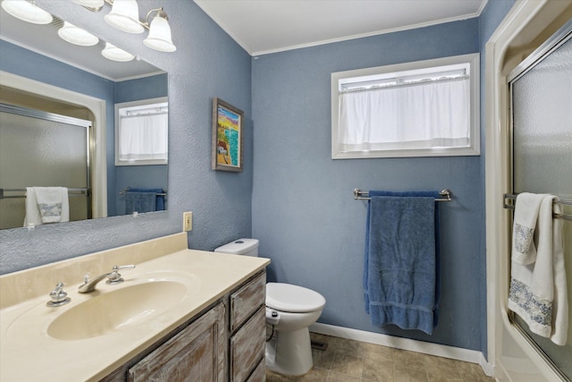 bathroom with vanity, ornamental molding, and toilet