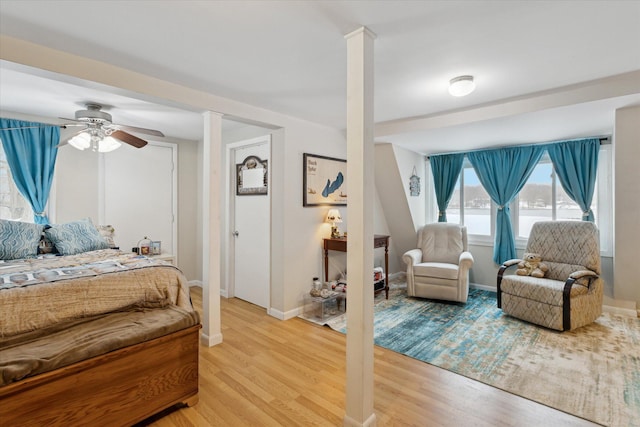 bedroom featuring light hardwood / wood-style floors and ceiling fan