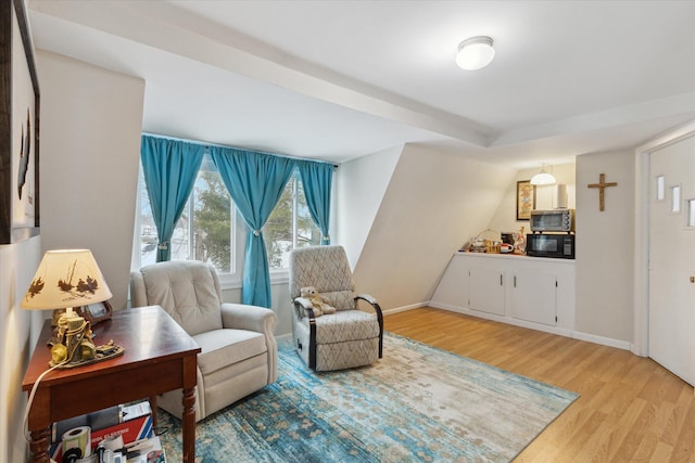 sitting room featuring light hardwood / wood-style floors