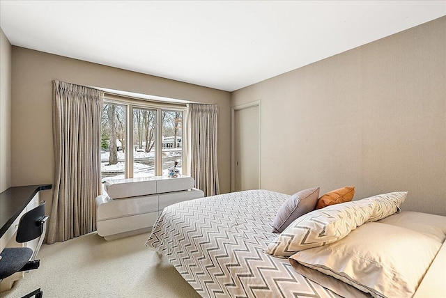 bedroom featuring light carpet