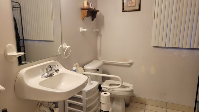 bathroom with tile patterned floors, toilet, and sink